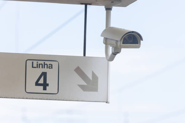 istock Security CCTV camera and a sign pointing to the way on train platform 1741199612