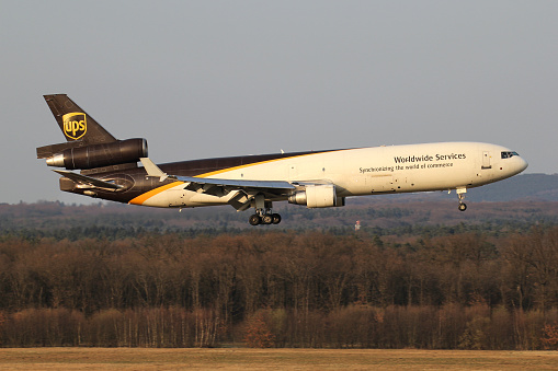 Cologne, Germany - April 9, 2015: UPS McDonnell Douglas MD-11F with registration N295UP on short final for runway 14L of Cologne Bonn Airport.