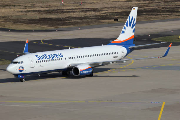 SunExpress Germany Boeing 737-800 Cologne, Germany - April 9, 2015: SunExpress Germany Boeing 737-800 with registration D-ASXP taxiing to terminal. sunexpress stock pictures, royalty-free photos & images