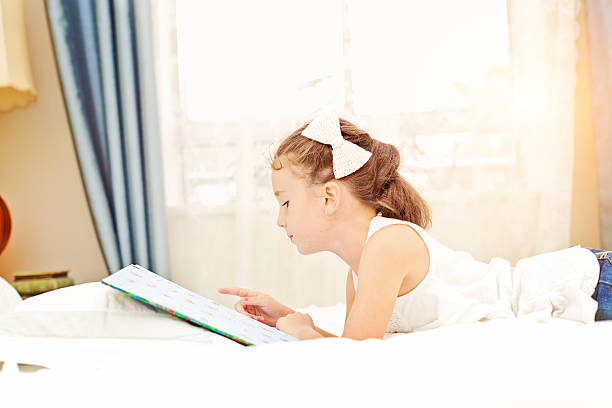 istock Little girl reading. 174121047