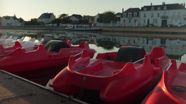 Idyllic village in the South of France with paddle boats waiting on tourists