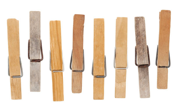 Wooden vintage clothespins Set of vintage weathered wooden clothespins isolated on white clothespin wood stock pictures, royalty-free photos & images
