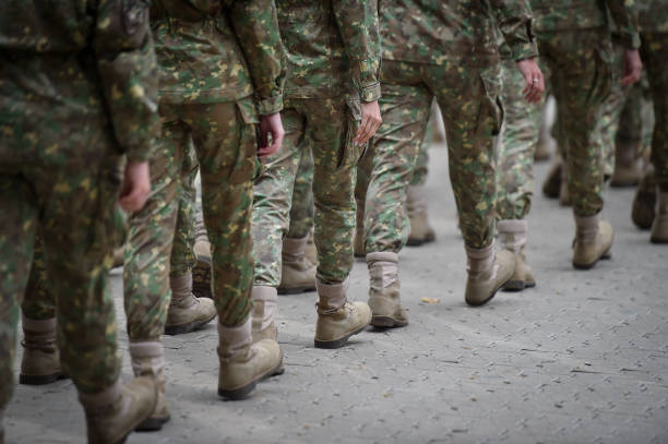 istock Soldiers in marching formation during military recruitment 1741247807