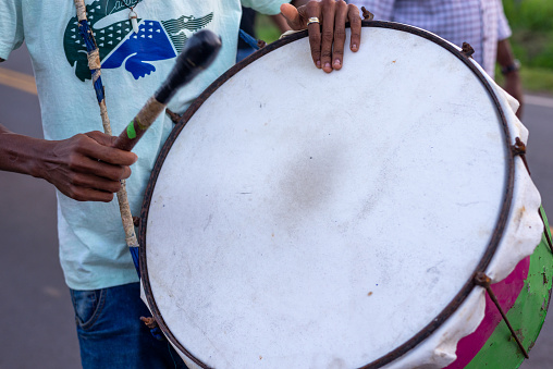 Valenca, Bahia, Brazil - June 28, 2022: Musicians play percussion instruments during the Levada do Mastro procession to honor Saint Peter in the city of Valenca, Bahia.