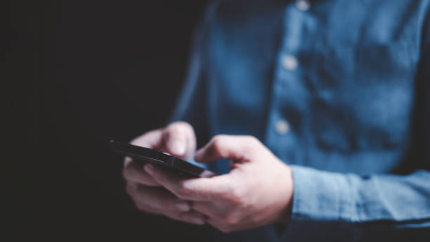 istock Businessman using smartphone to send message and surf the Interne 1741279763