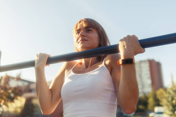 istock Woman Is Doing Chin Ups 1741285089