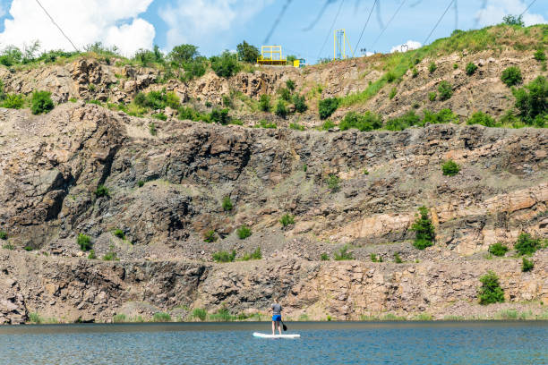 istock Woman on sup board with paddle in the lake 1741286847