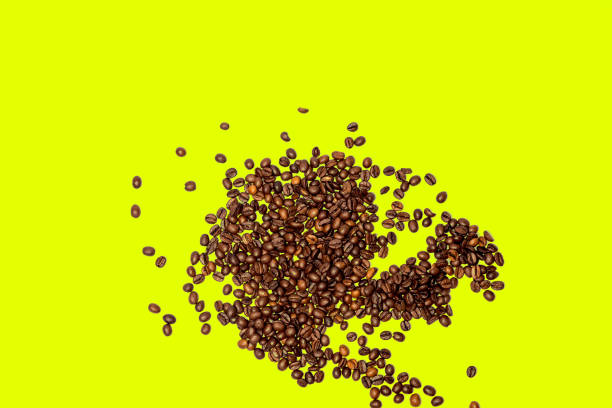 istock The coffee beans isolated on a bright yellow background. 1741292407