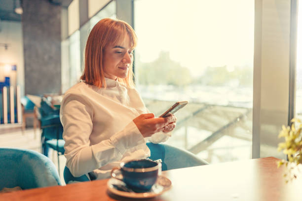 istock Texting To A Friend To Come At Coffee shop 1741312749