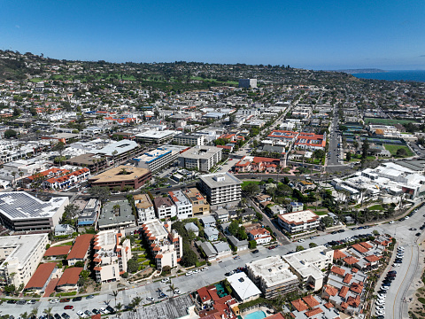 An aerial shot from over the Pacific Ocean of the residential area of La Jolla located within the city limits of San Diego, California.