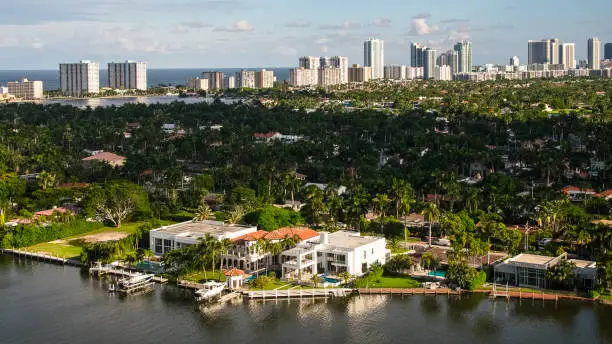 Wealthy coastal neighborhood with villas and mansions along the marina in Hollywood, Florida. Aventura's suburbs and Sunny Isles aerial view