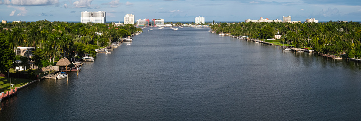 North Lake Canal lead to Hollywood Beach by the Atlantic Ocean in Hollywood, Florida. Wealthy coastal neighborhood stretching along the palm lined shore.