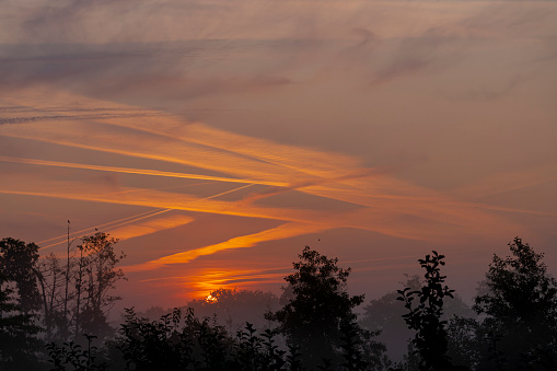 View of a colorful sunrise in the Normandy countryside
