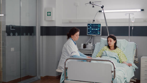 istock Specialist doctor putting oximeter checking pulse talking with sick woman 1741336800