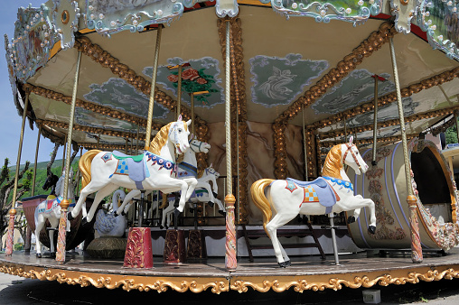 Colorful horse as part of a vintage merry-go-round for children on a playground