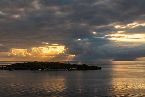 Exposure of the view of the beautiful port of Roatan, Honduras, in the Caribbean Bay, part of the huge Mesoamerican Barrier Reef, taken from a cruise ship at sunrise.