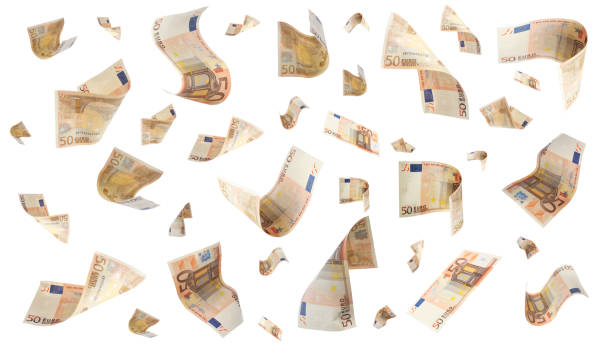 istock Many euro banknotes flying on white background 1741384313