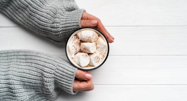 istock Woman holding cacao mug in hands 1741384583