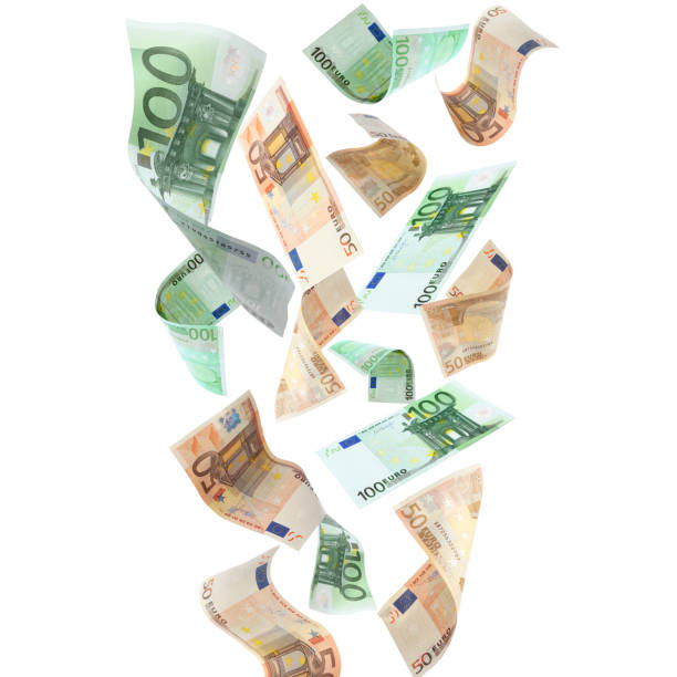 istock Many euro banknotes flying on white background 1741384847