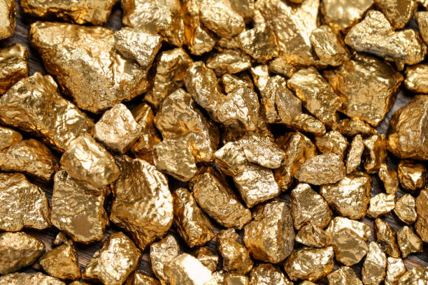 istock Pile of gold nuggets as background, top view 1741385966