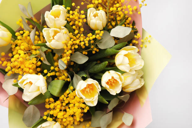 istock Bouquet of beautiful spring flowers on light grey background, top view 1741397914