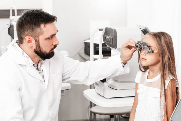 istock Cute girl visiting ophthalmologist 1741397946