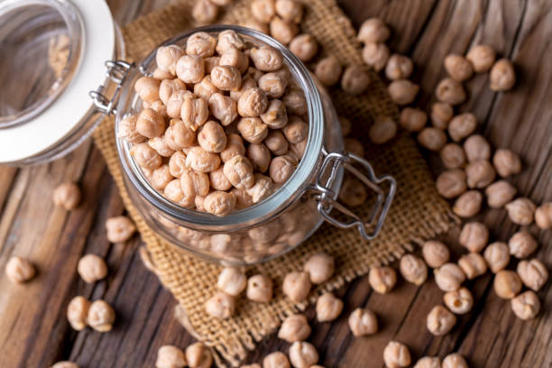 istock Dried raw chickpea on the wooden background 1741405088
