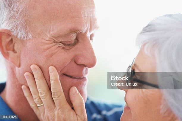 Closeup Of A Romantic Senior Man And Woman Looking At Eachother Stock Photo - Download Image Now