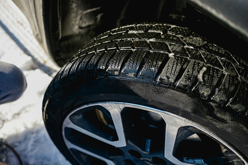 Closeup of car tires in winter.