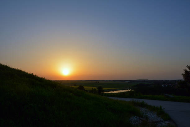 istock Evening rounded road in perspective near the hillside. 1741437192