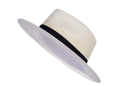 Panama hat style straw hat with black ribbon isolated on white background, straw hat for woman and man head protection iamge