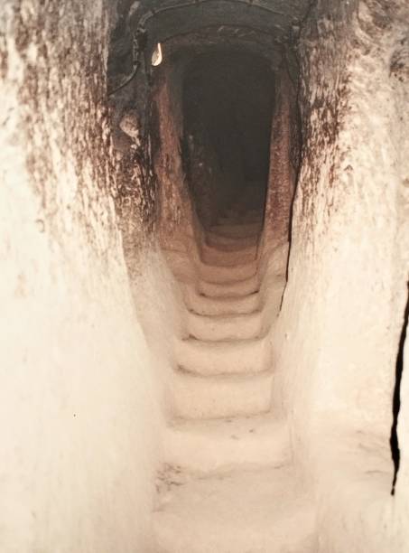 istock A narrow step into the dark interior of Kaymakli 1741465376