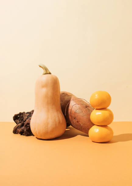 istock Creatively arranged butternut squash, sweet potato and tangerines close-up. 1741471572