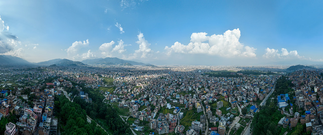 Aerial view of Kathmandu, Kirtipur, hills, palaces and buildings. Terraces and homes, city streets. Nepal. 10-13-2023
