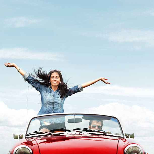 istock Happy young people in a cabriolet 174149550