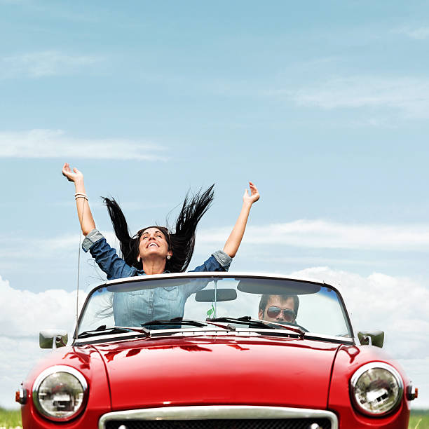 istock Happy young people in a cabriolet 174149554