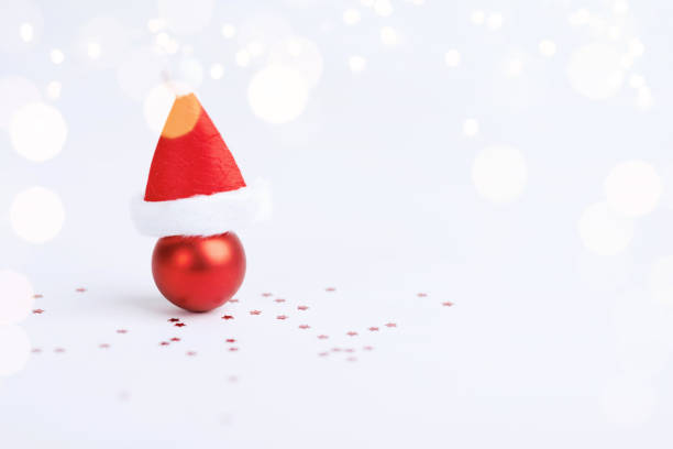 istock Christmas ball with Christmas hat on white background 1741514190