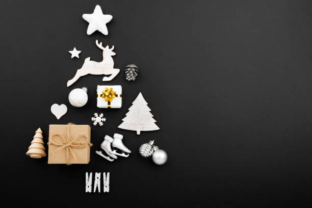 istock Christmas tree made of decorations on black background 1741525894