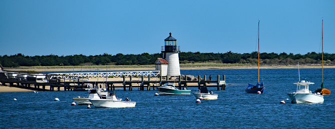 A beautiful day ends with a ferry ride passed the Brant Point lighthouse and the few boats in the harbor