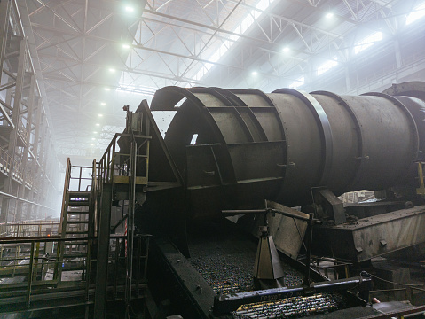 Production line of Iron ore pellets. Ore rumbling machines.