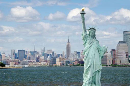 Statue of Liberty in New York with the city skyline in the background.