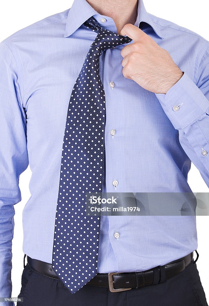 Uomo d'affari tirando il collo. - Foto stock royalty-free di Abbigliamento casual