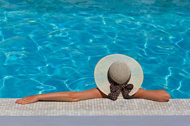 istock Young woman relaxed at the pool 174163508