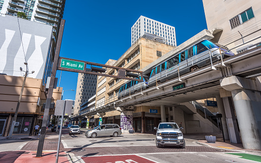 Miami, Florida, USA - October 17, 2023: The Metromover on its way over a major highway near downtown Miami. Metromover is a free mass transit automated people mover train system operated by Miami-Dade Transit in Miami, Florida, United States
