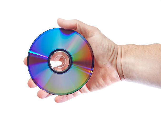 istock Man in the hand lerzhit cd drive. Close-up . 174168672