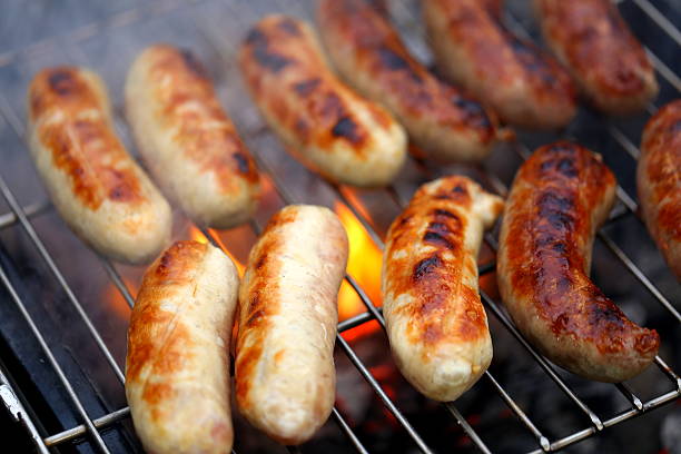 istock Nicely grilled sausages on a whole background 174168937