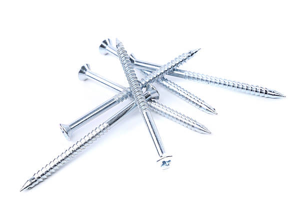 istock Random pile of threaded steel screws on white 174169897