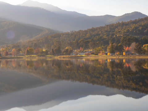 Mount Beauty in the Victoria High Country at Autumn reflected in the lake