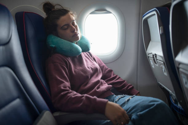 istock Taking a nap in the airplane while traveling. 1741713982