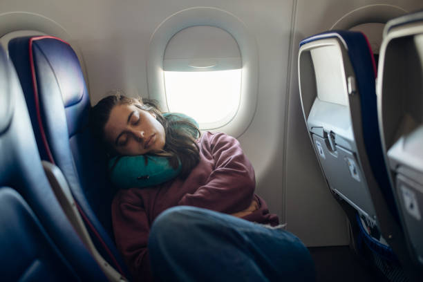 istock Taking a nap in the airplane while traveling. 1741714540